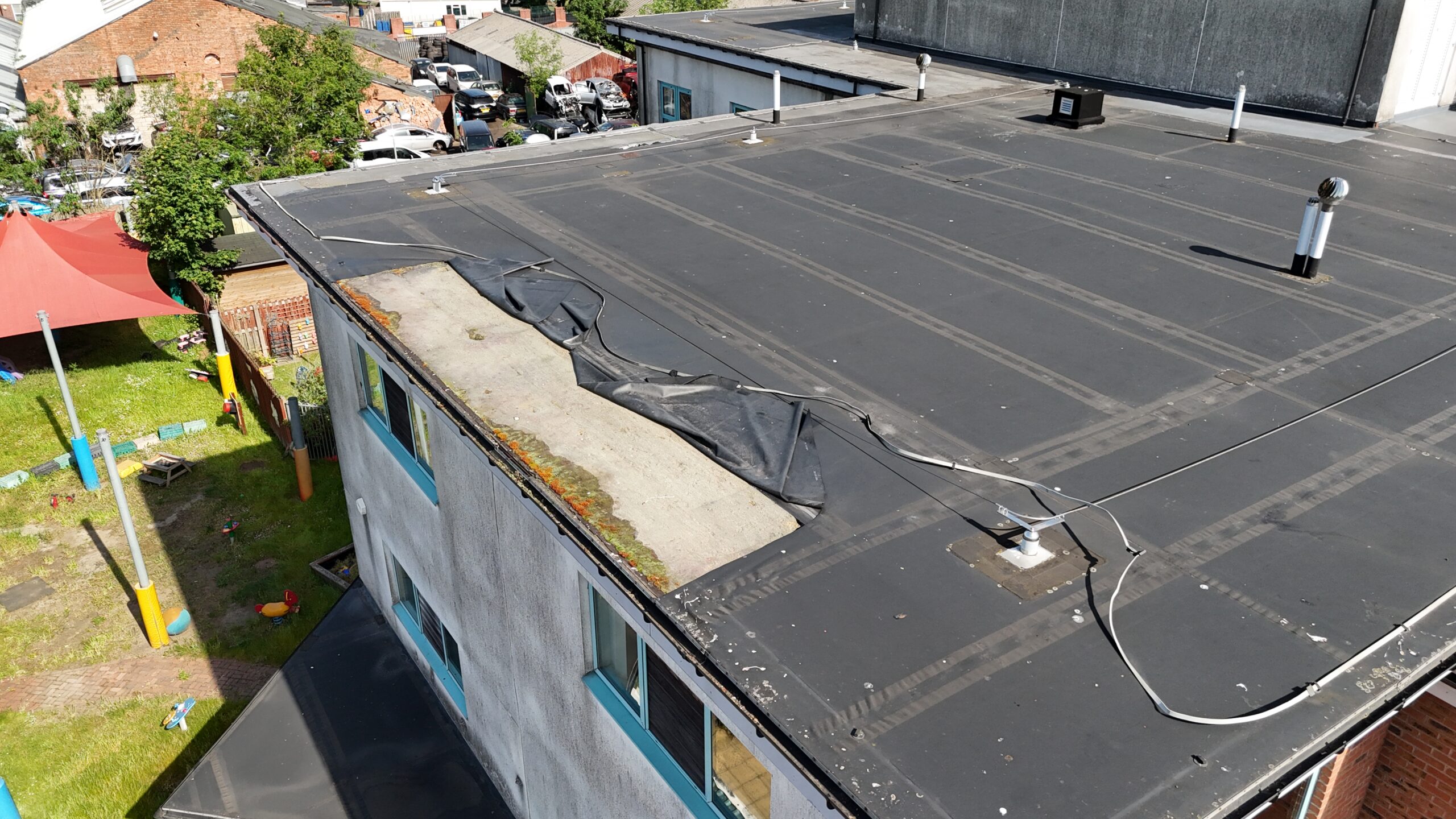 Drone roof survey showing defective flat roof membrane to a commercial building